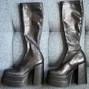 Knee high, tight, shiny, Cypress platform boots with chunky heel.